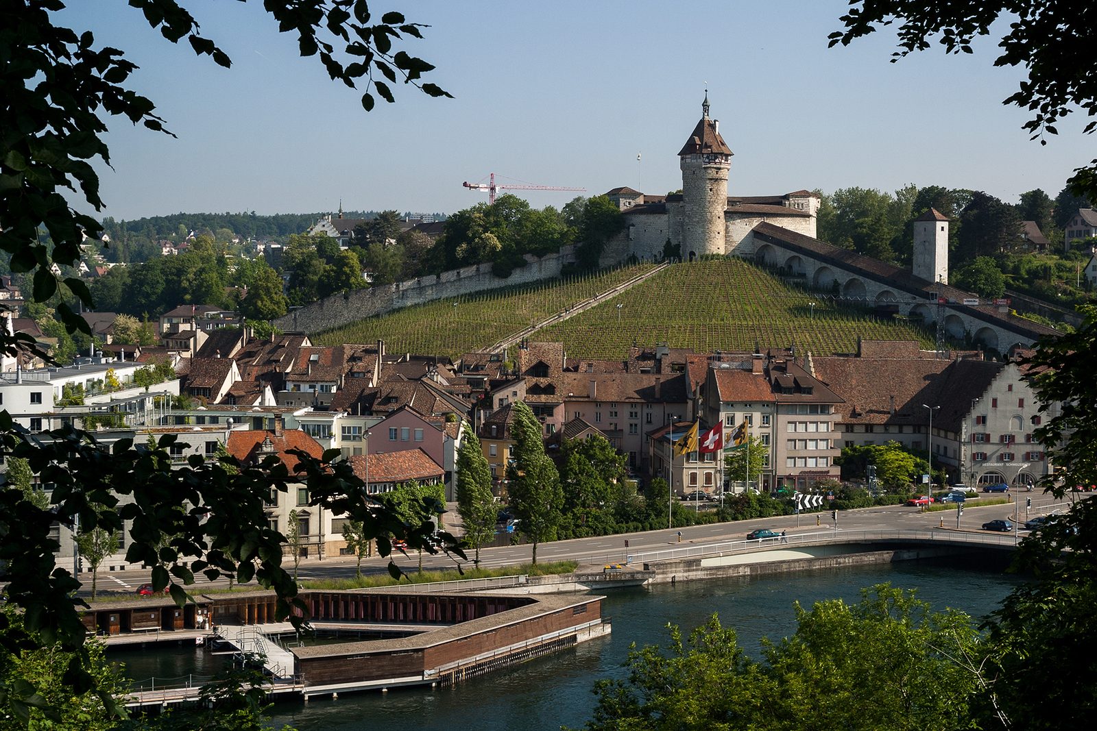 Activities near Schaffhausen: the wooden Rhybadi river bath on the Rhine below the Munot and its vineyard
