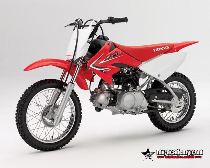 Dirt bike for kids in Dubai: small red Honda CRF70 with white front plate and knobbly tyres, product photo