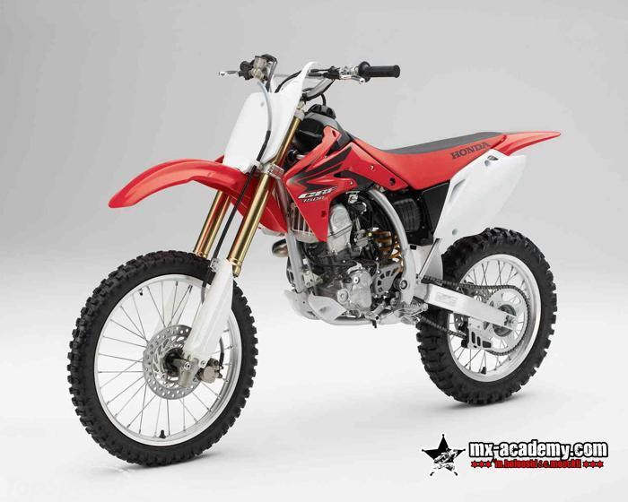 Motocross bike rental Dubai: red Honda CRF150R with white side panels and gold-coloured fork, product photo