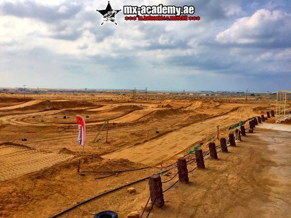 Motocross training in Dubai video: wide view of the sand track with jumps and barriers