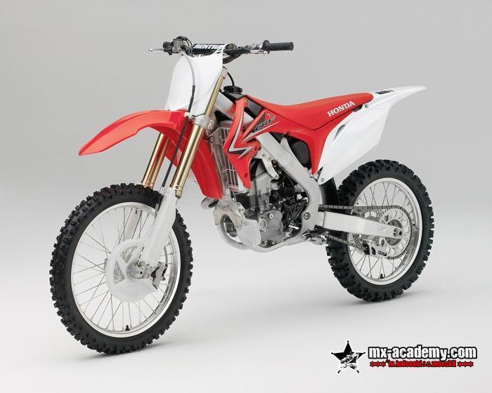 Motorbike rental in Dubai: red and white Honda CRF with knobbly tyres and a white front plate, product photo