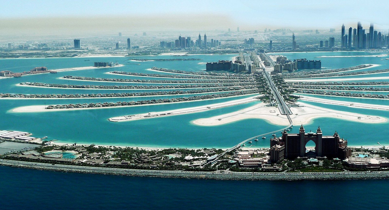 Places to visit in Dubai by the sea: the fronds of Palm Jumeirah from above, with Atlantis and Marina towers