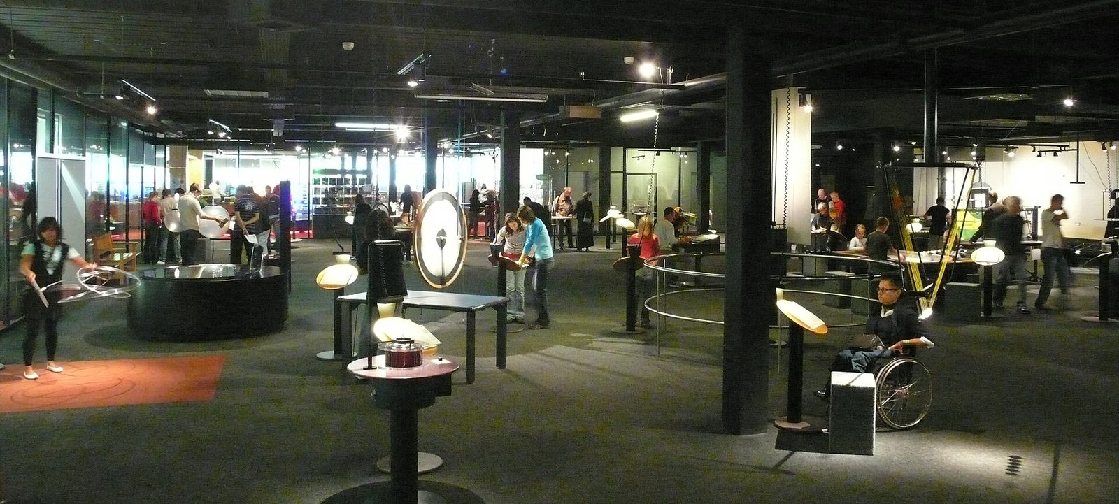 What to do in Switzerland on a rainy day: visitors try hands-on experiment stations in a large indoor hall